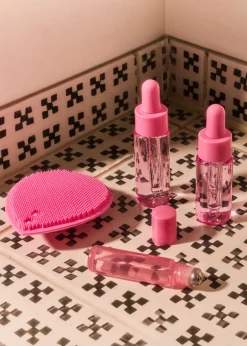 Set da viaggio rosa con flaconi dosatori - 4 pz